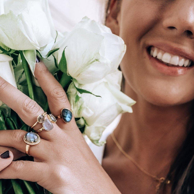 Simone Watson Jewellery - A beautiful ring featuring a rose cut Labradorite stone surrounded by a halo of pave set cubic zirconias