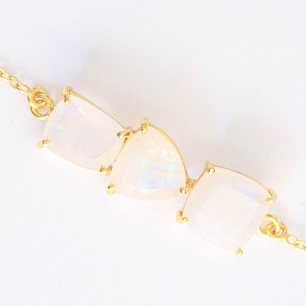 Three beautiful Moonstones create a unique balanced bar style bracelet, set on a dainty gold-plated adjustable chain