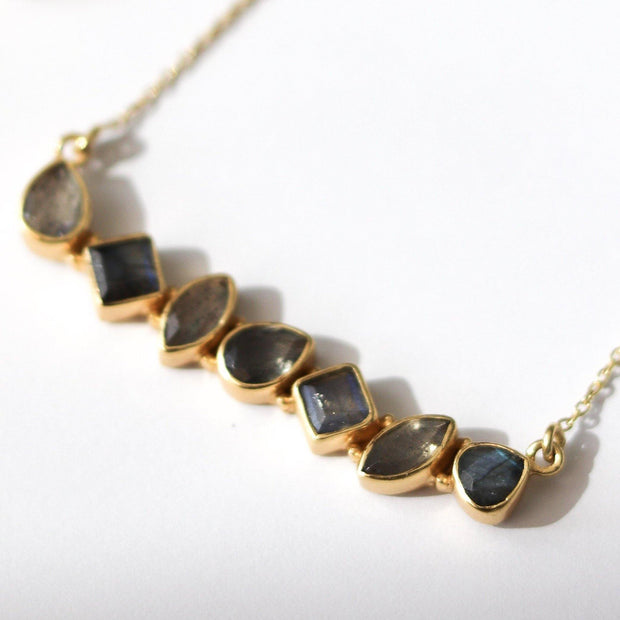 Our Bar Necklace features a row of Labradorite stones set in a balanced and bold bar style handmade in sterling silver and 14ct gold plating