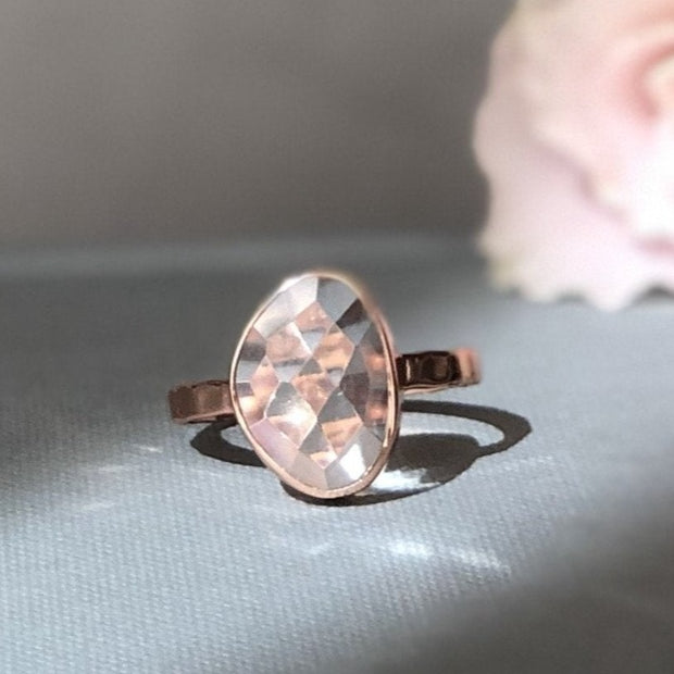 A rose-cut Crystal Quartz stone is set on a single band. Handmade in sterling silver & 14-carat rose gold plating.