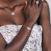 Simone Watson Jewellery Our Silver Halo bracelet features a beautiful semi-precious gemstone surrounded by a halo of pave set cubic zirconias on a dainty adjustable chain. Available in Green Amethyst and Smokey Quartz