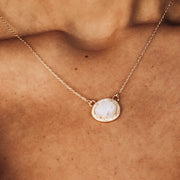 Simone Watson Jewellery Collection This beautiful pendant features a rose cut Rainbow Moonstone surrounded by a halo of pave set cubic zirconias set on a dainty adjustable chain
