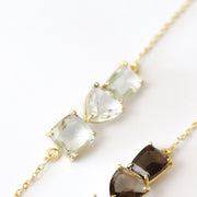This unique bar bracelet features three green amethyst stones set on a fine dainty gold-plated adjustable chain