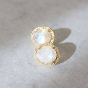 A pair of Rainbow Moonstone semi-precious stones surrounded by a halo of pave set cubic zirconias - adding a subtle touch of glam to your day or night look