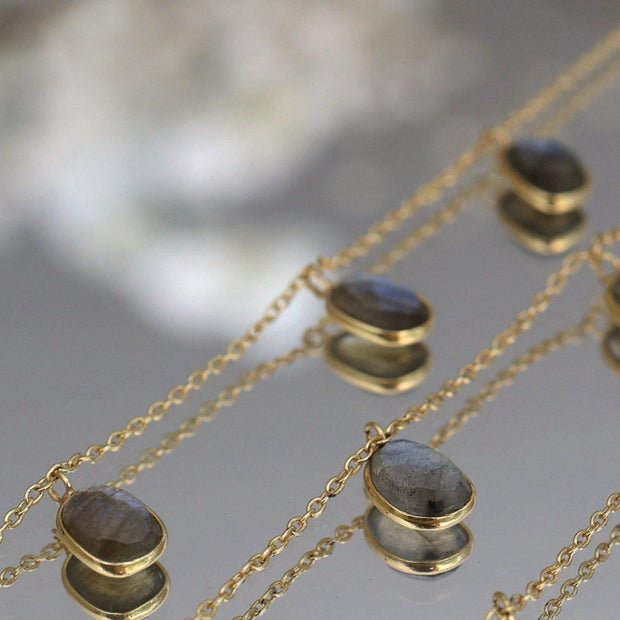 Three labradorite stones are delicately attached to a fine gold plated chain to create this elegant and easy to wear bracelet