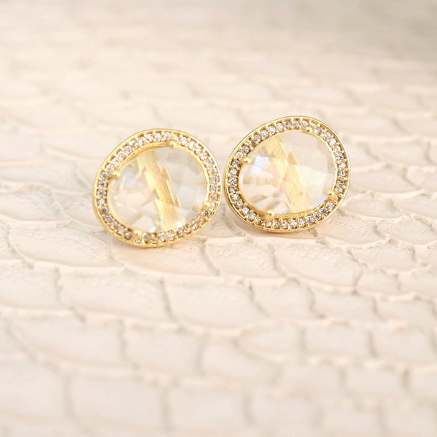 A pair of beautiful rose cut Crystal Quartz stones set in a pave halo and handmade in sterling silver and 14 carat yellow gold plating - adding a subtle finishing touch to your day or night look