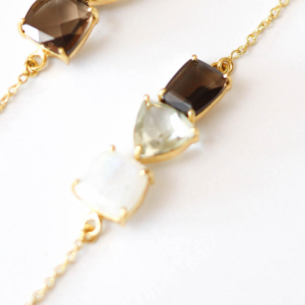Three beautiful semiprecious gemstones create a unique bar style bracelet, set on a dainty gold-plated adjustable chain