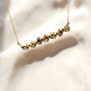 This unique Bar Necklace features a row of Smokey Quartz stones set in a bold bar style. Handmade in sterling silver and 14 carat gold plating