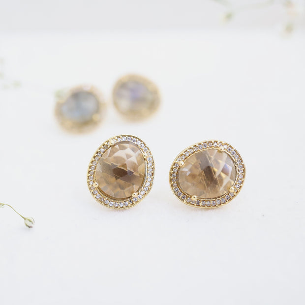 A pair of beautiful rose cut Smokey Quartz stones set in a pave halo and handmade in sterling silver and 14 carat gold plating - adding a subtle finishing touch to your day or night look