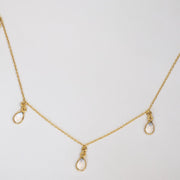 This Charm Necklace features five pear-shaped Crystal Quartz semi-precious stones, placed onto a fine gold-plated chain. A lightweight and easy-to-wear necklace