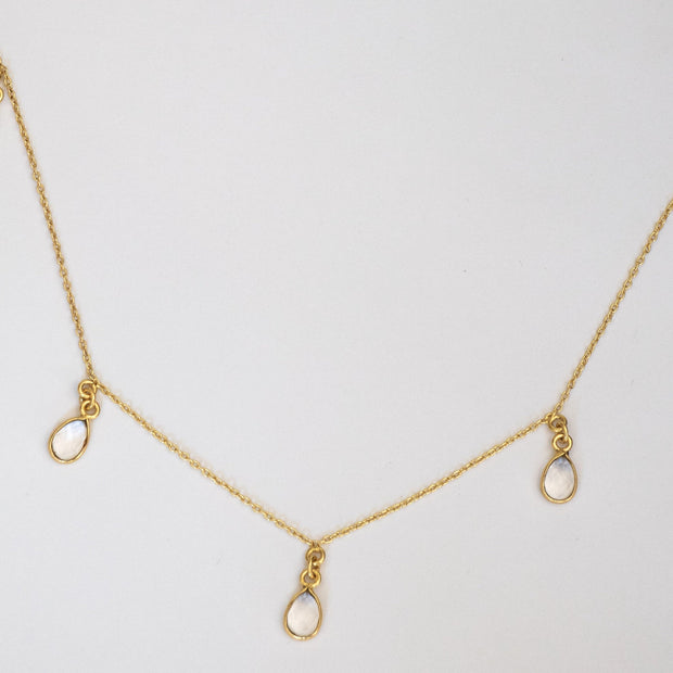 This Charm Necklace features five pear-shaped Crystal Quartz semi-precious stones, placed onto a fine gold-plated chain. A lightweight and easy-to-wear necklace