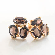 A pair of Smokey Quartz cluster studs feature three uniquely shaped semi-precious gemstones. Wear these day or night to add a subtle touch of glamour to your look