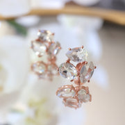 A pair of Silver and Rose Gold Plated Green Amethyst cluster studs feature three uniquely shaped semi-precious gemstones. Wear these day or night to add a subtle touch of glamour to your look 