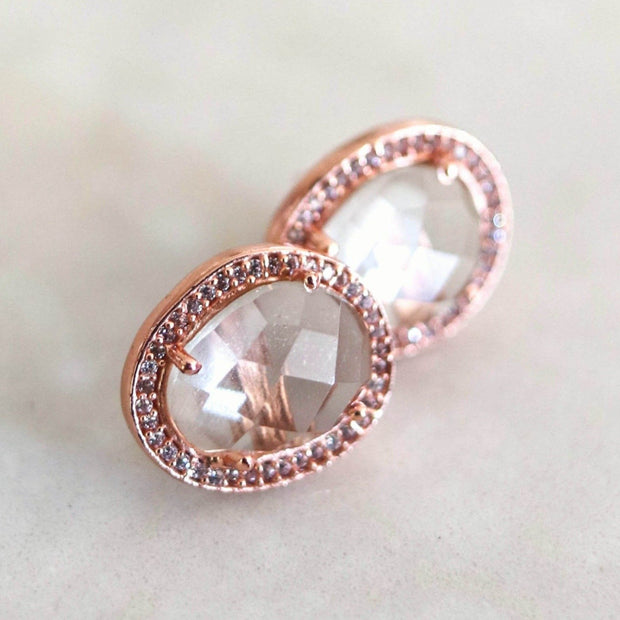 A pair of Green Amethyst rose cut stones set in a pave halo and handmade in sterling silver and 14 carat rose gold plating -adding a subtle finishing touch to your day or night look