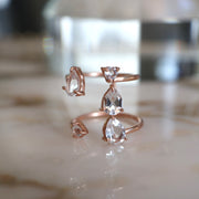 Stunning and unique, our Cascade ring features Crystal Quartz semi precious stones set on a double band cuff style setting. Handmade in silver and 14 carat rose gold plating 