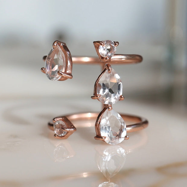 Stunning and unique, our Cascade ring features Crystal Quartz semi precious stones set on a double band cuff style setting. Handmade in silver and 14 carat rose gold plating 