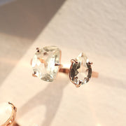 A unique cuff ring features two beautiful Green Amethyst stones - set in sterling silver and 14 carat rose gold plating