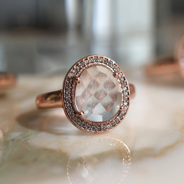 This pretty rose gold plated ring features a rose cut Crystal Quartz stone surrounded by a halo of pave set cubic zirconias 