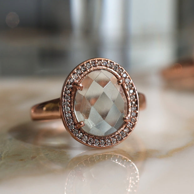 This beautiful ring features a rose cut Green Amethyst stone surrounded by a halo of pave set cubic zirconias. Handmade in sterling silver and 14 carat gold plating
