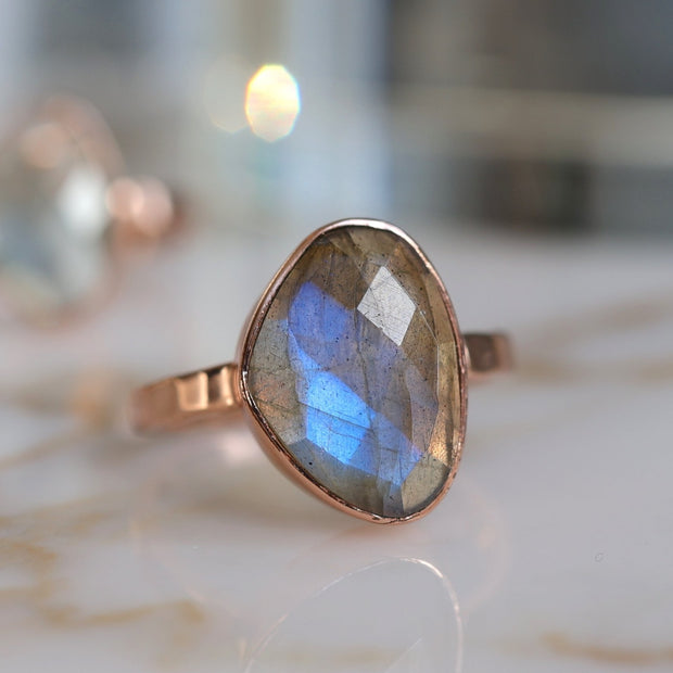 A beautiful Labradorite solitaire stone is set on a single band - perfect for wearing alone or with stacking rings