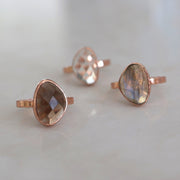 A beautiful rose-cute Smokey Quartz stone is set on a single rose gold plated band - wear solo or paired when more stacking rings