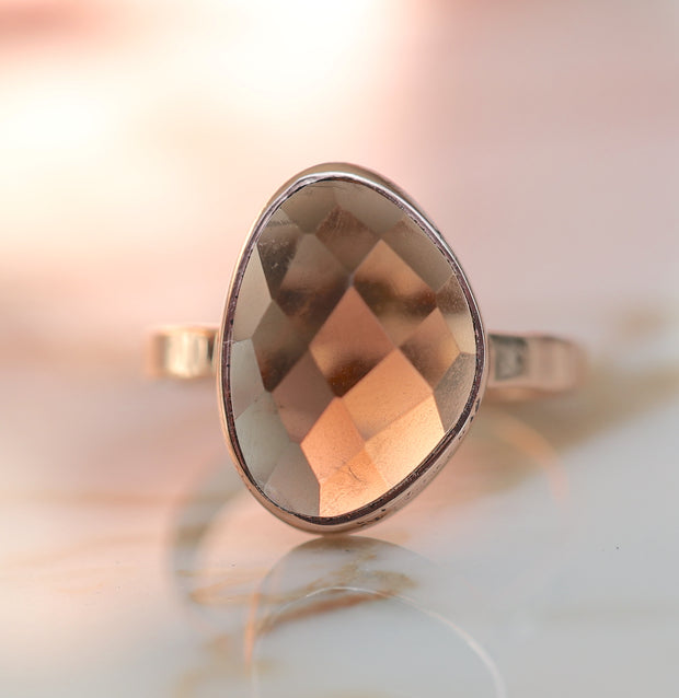 A beautiful rose-cute Smokey Quartz stone is set on a single rose gold plated band - wear solo or paired when more stacking rings