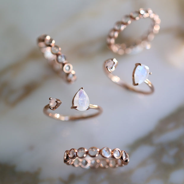 This elegant single band cuff ring is handmade in sterling silver and plated in 14 carat rose gold - featuring two iridescent semiprecious Rainbow Moonstones