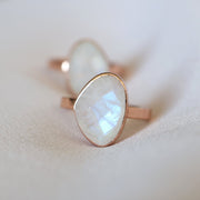 A rose cut Rainbow Moonstone is centre stage in this solitaire ring design. A perfect addition to a ring stack or bold enough to be worn on its own