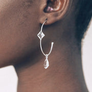 These charming hoop earrings are handmade in sterling silver featuring green amethyst semi-precious gemstones