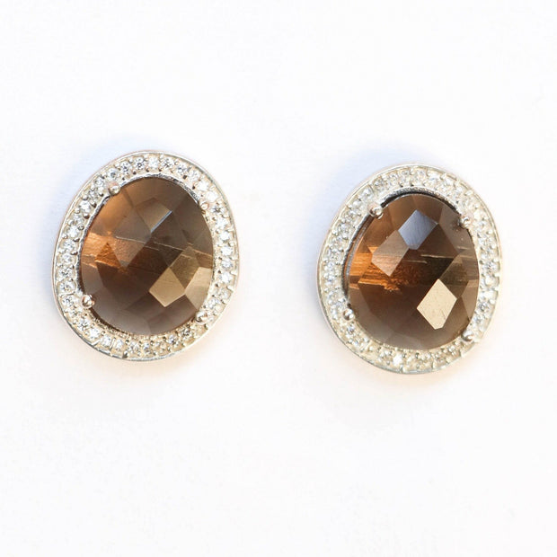 A pair of Smokey Quartz stones are surrounded by a halo of pave set cubic zirconias - Adding a subtle touch of shimmer to your day or night look