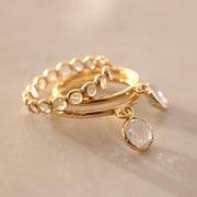 This is the perfect stacking ring addition featuring a round Crystal Quartz stone charm set on a smooth gold-plated band. Have fun with this ring by stacking many together or add to other ring stacks 
