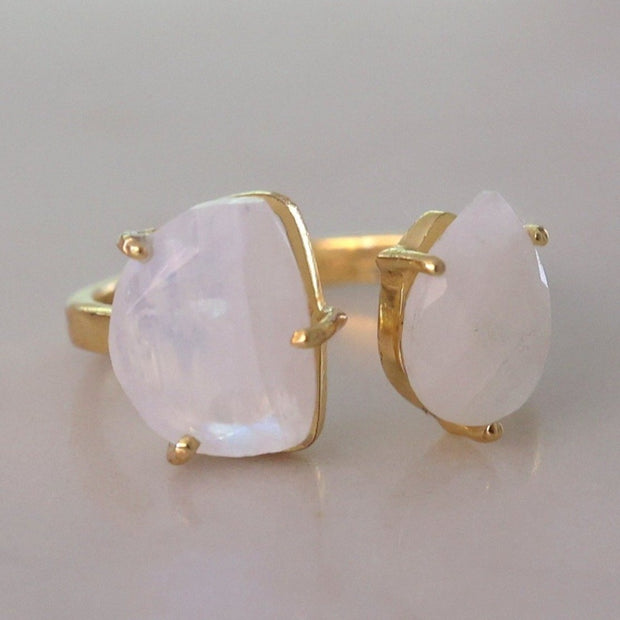This unique cuff ring features half moon and pear shaped Rainbow Moonstones set in sterling silver and 14 carat gold plating