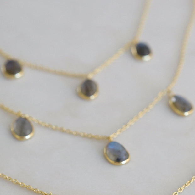 Three labradorite stones are delicately attached to a fine gold plated chain to create this elegant and easy to wear bracelet